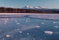 A winter landscape mountains and silhouettes of trees.Sunrise.Pink ice reflections . North landscape