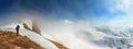 Winter landscape, panorama, banner - top view of the mountain range and tourist with a camera Royalty Free Stock Photo