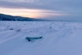 Winter landscape with ridged ice on the frozen river