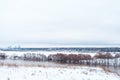 Winter landscape, river against a forest of snow-covered trees. Beautiful winter background in nature. White hills in Royalty Free Stock Photo