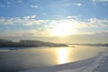 Winter landscape of river with sun reflections. Wild nature Royalty Free Stock Photo