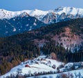 Winter landscape in Romania with nature, mountain, forest, village Royalty Free Stock Photo