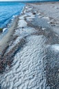 Winter landscape, Salt water frozen by waves on the sandy shore of the Tiligul estuary, Odessa region