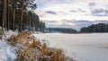 Winter landscape on the shore of the frozen river in the evening, Russia, Ural Royalty Free Stock Photo