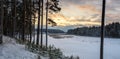 Winter landscape on the shore of the frozen river in the evening, Russia, Ural Royalty Free Stock Photo