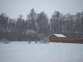 Winter landscape in Siberia wooden house in snow forest in snowdrifts Royalty Free Stock Photo