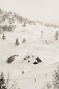 Winter landscape with a skier and a wooden hut Royalty Free Stock Photo