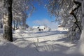 A winter landscape in a small town in Bavaria with an old farmhouse covered with snow Royalty Free Stock Photo