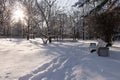 Winter landscape snow covered bench in the city park Royalty Free Stock Photo