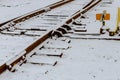 Winter landscape with snow covered rails on a road railway in a snowy scene Royalty Free Stock Photo