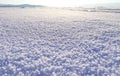 Winter landscape. Snow field sparkling in the sun, surface snow texture. Christmas natural background. Lake Baikal Royalty Free Stock Photo