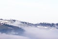 Winter landscape with snow and fog in the Tosco Emiliano Apennines, Bologna, Italy