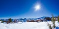 Winter landscape with snow, wooden houses and clear blue sky, Trikala Korinthias.