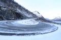 Winter landscape of a snowy road bend in Norway