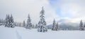 Winter landscape. Spectacular panorama is opened on mountains, trees covered with white snow, lawn and blue sky with clouds Royalty Free Stock Photo