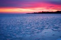 Winter landscape with sunset fiery sky.