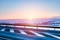 Winter landscape, sunset over the hills near the national road Royalty Free Stock Photo