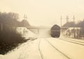 Winter landscape with train in color sepia Royalty Free Stock Photo