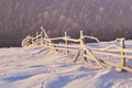 Winter landscape trees and fence in hoarfrost, background with some soft highlights and snow flakes Royalty Free Stock Photo