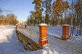 Winter landscape with a view of the stone bridge and chapel Royalty Free Stock Photo