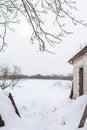 Winter landscape in the village. View of the snowy field Royalty Free Stock Photo