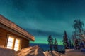 Winter landscape with wooden house under a beautiful starry sky Royalty Free Stock Photo