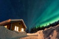 Winter landscape with wooden house under a beautiful starry sky Royalty Free Stock Photo