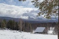 Winter landscape. Wooden hut in the middle of a snowy forest Royalty Free Stock Photo