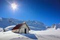 Winter landscape with wooden toolshed at Balea lake, Sibiu county, Romania. Royalty Free Stock Photo