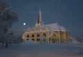 Arvidsjaur church with moon. Winter in Lapland, Sweden, Norrbotten