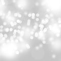 Winter light and white abstract bokeh on a bluish background