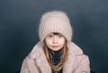 Winter little girl cold freeze gesture expression with fur clothes fashion and cap