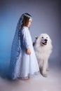 Winter little girl with dog, symbol of new year Royalty Free Stock Photo