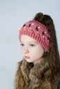 Winter little girl in fur and hat Royalty Free Stock Photo