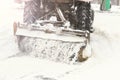 Winter, a lot of snow. The tractor clears the snow. Royalty Free Stock Photo