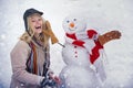 Winter love concept. Making snowman and winter fun. Give a wink. Young woman winter portrait. Sensual winter girl wiht Royalty Free Stock Photo