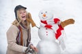 Winter love concept. Making snowman and winter fun. Give a wink. Young woman winter portrait. Sensual winter girl wiht Royalty Free Stock Photo