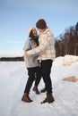 Winter love story against the background of a snowy forest and lake Royalty Free Stock Photo