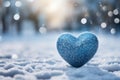 Winter love symbol Blue heart on snow with bokeh background Royalty Free Stock Photo