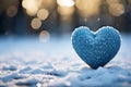 Winter love symbol Blue heart on snow with bokeh background Royalty Free Stock Photo