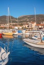 Winter Mediterranean landscape. Fishing boats in harbor. View of Marina Kalimanj in Tivat city. Montenegro Royalty Free Stock Photo