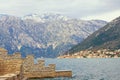 Winter Mediterranean landscape. Montenegro,  Adriatic Sea, Bay of Kotor, Stoliv. Perast town in distance Royalty Free Stock Photo
