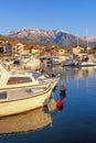 Winter Mediterranean landscape. Montenegro. View of Tivat city and Marina Kalimanj for fishing boats and yachts Royalty Free Stock Photo