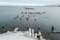 Winter minimalistic landscape with an old ruined pier in the Arctic. Long exposure