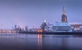 Winter foggy evening on the Oder river, view on the embankment and beautiful architectural building of St. John the Baptist Cathed