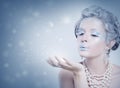 Winter Model Snow Queen. Woman Blowing Snow Royalty Free Stock Photo