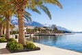 Winter in Montenegro. Embankment of seaside Tivat town with Lovcen mountain in the background