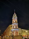 Duma Tower on Nevsky Prospekt in St. Petersburg, decorated with lights and garlands for Christmas and New Year