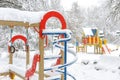 Winter in Moscow, Russia. Scenery of empty snowy colorful playground. Scenic view of urban kids park under snow