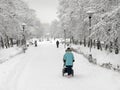 Winter, mother with stroller outdoor Royalty Free Stock Photo